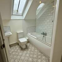 Ensuite bathroom with bath