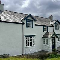 FRONT PORCHED PAINTED WHITE NEW PHOTO JUNE 2026