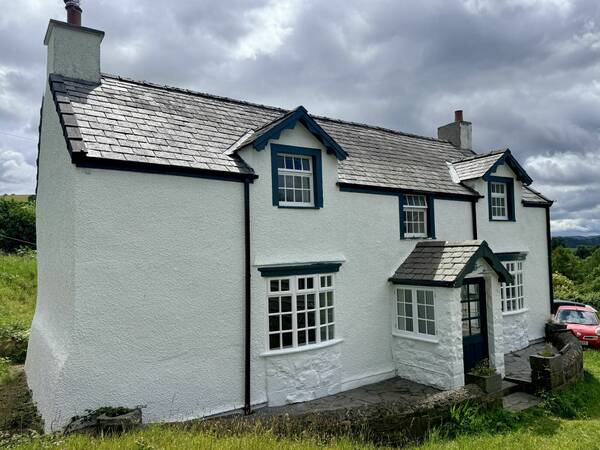 FRONT PORCHED PAINTED WHITE NEW PHOTO JUNE 2026